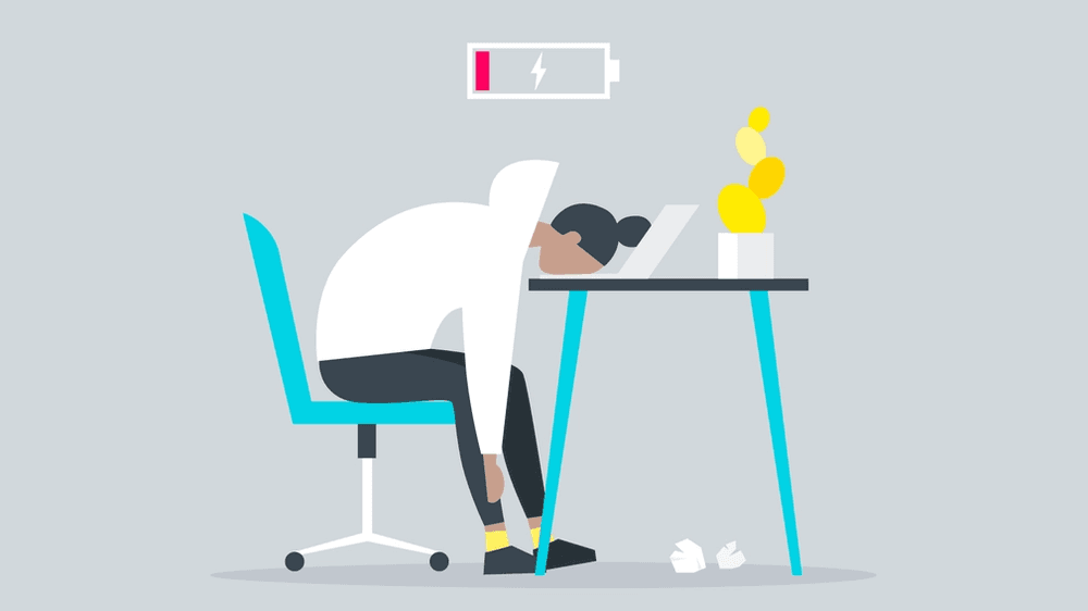 Cartoon image of a girl slumped over on her desk with her face in her laptop