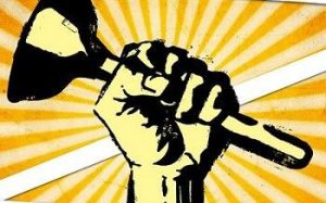 Image of a fist holding up a plunger in defiance.