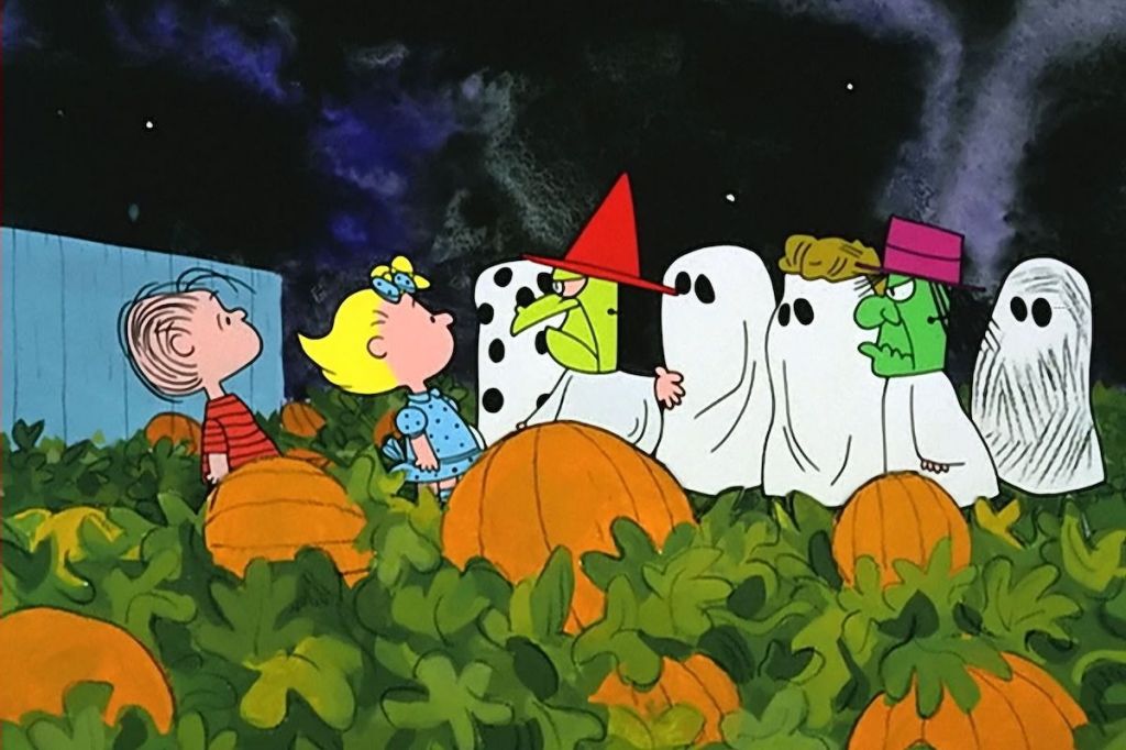 Photo from the movie "It's the Great Pumpkin, Charlie Brown". Charlie Brown and his friends are dressed as ghosts in a pumpkin patch.