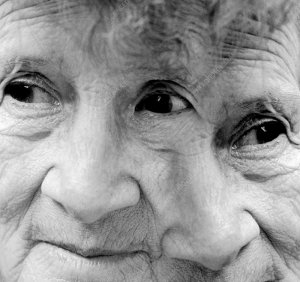 Dementia, conceptual image. Composite merger of two images of an old woman's face. This image can represent ageing disorders such as dementia and Alzheimer's disease, where mental faculties and memory decline due to degeneration of the brain.