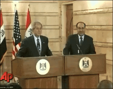 GIF of Iraqi journalist Muntadhar al-Zaidi throwing a shoe at George Bush. Unfortunately Bush is able to dodge in time.