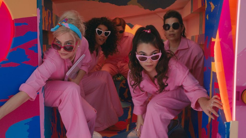 Scene from the 2023 Barbie movie. The Barbies are getting ready to un-brainwash the other Barbies by sharing how impossible it is to be a woman.