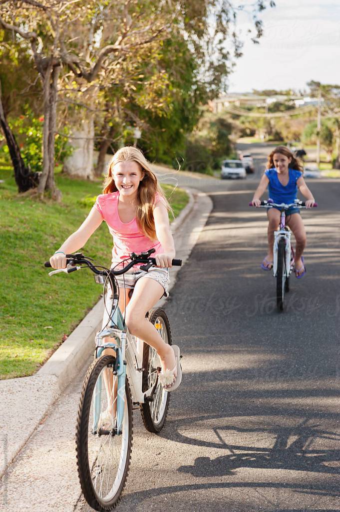 Two girls riding on their bikes. This was one of my favorite things to do with the first friend I mentioned.