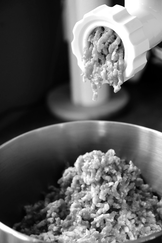 black and white image of a meat grinder